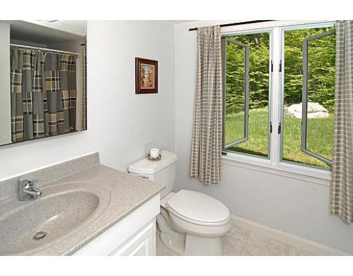 10 Stage Coach Road Boxford, MA 01921 - Photo 19 of 21 a bathroom with a granite countertop sink mirror vanity and toilet