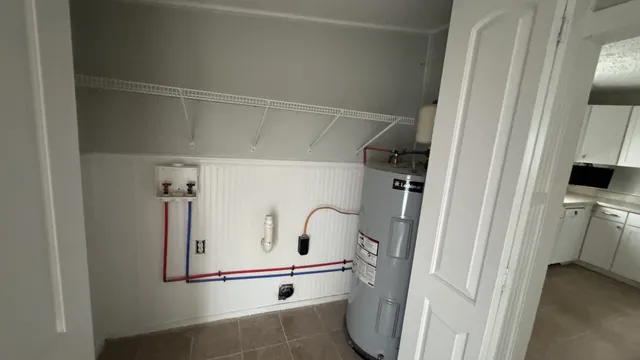 a white refrigerator freezer and a stove sitting inside of a kitchen
