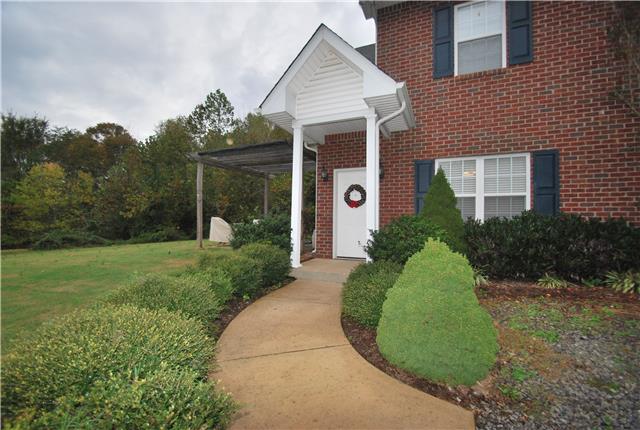 317 Maxwell Branch Road Cottontown, TN 37048 - Photo 16 of 22 Covered front porch keeps you out of the rain and features stately columns