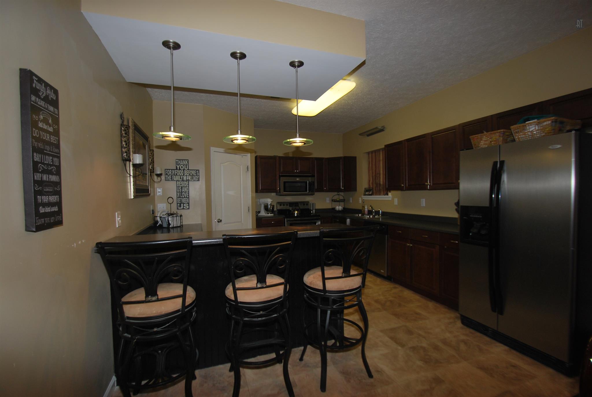 317 Maxwell Branch Road Cottontown, TN 37048 - Photo 3 of 22 Large kitchen with walkin pantry, stainless appliances, pendent lighting, dbl oven and lots of cabinets!