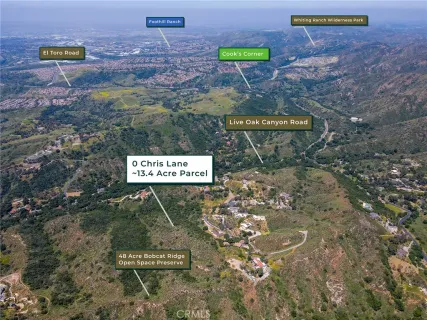 an aerial view of residential house and green space
