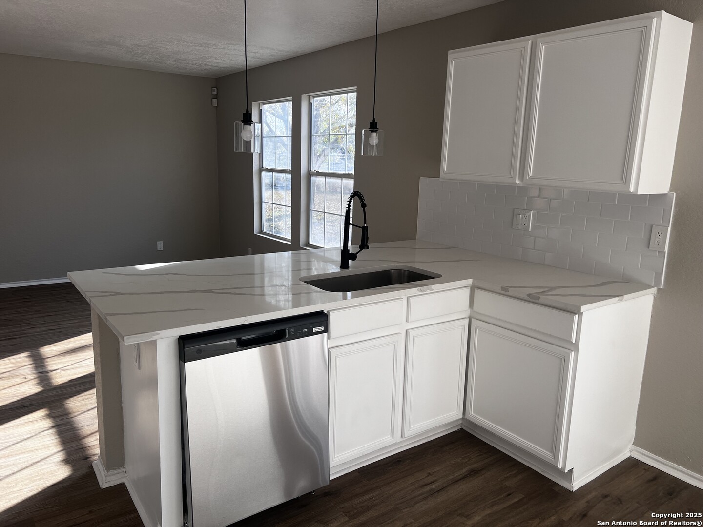 735 Inks Farm San Antonio, TX 78228 - Photo 4 of 17 a close view of kitchen island with wooden floor