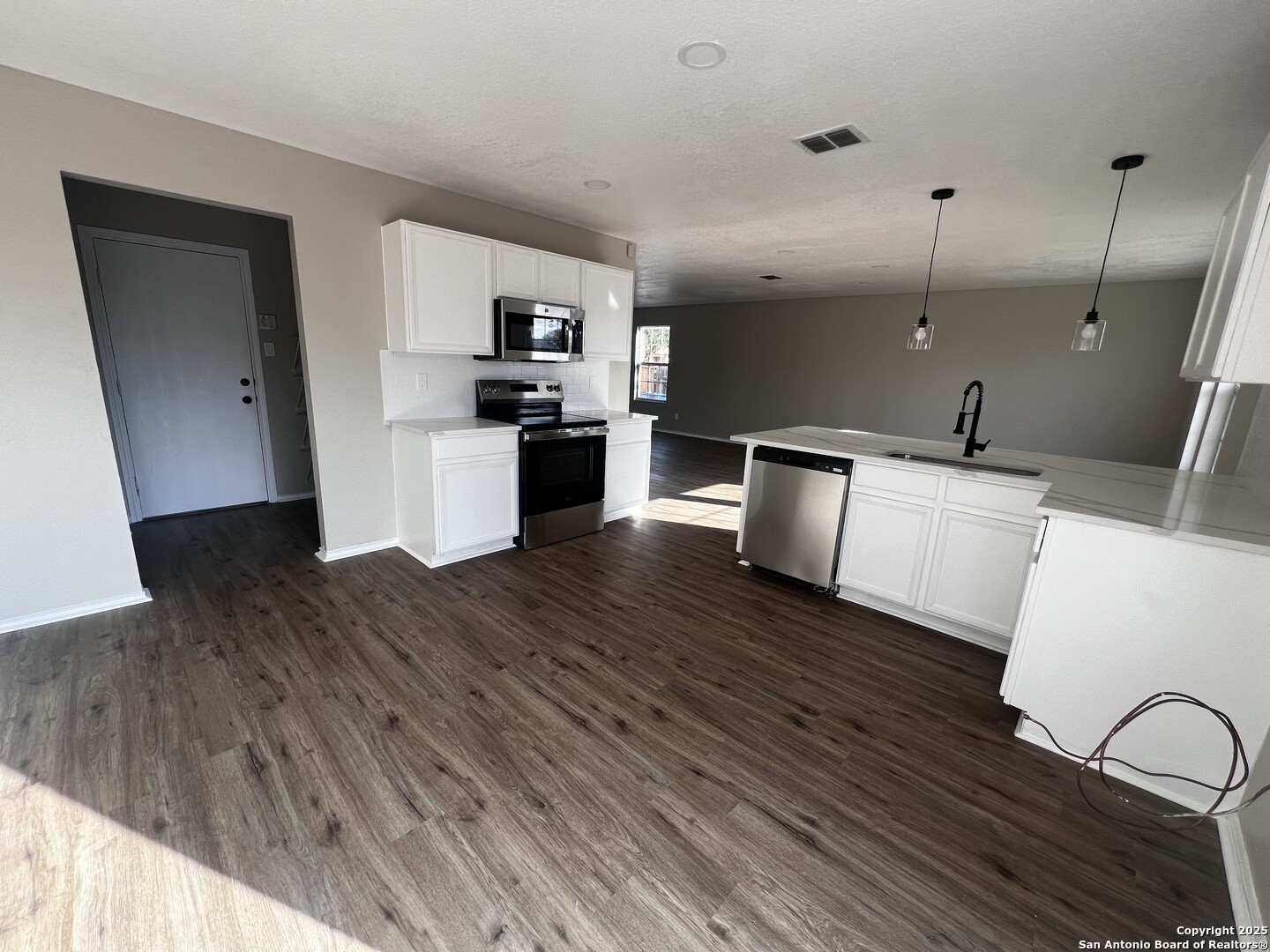 735 Inks Farm San Antonio, TX 78228 - Photo 6 of 17 a kitchen with a sink and wooden floor