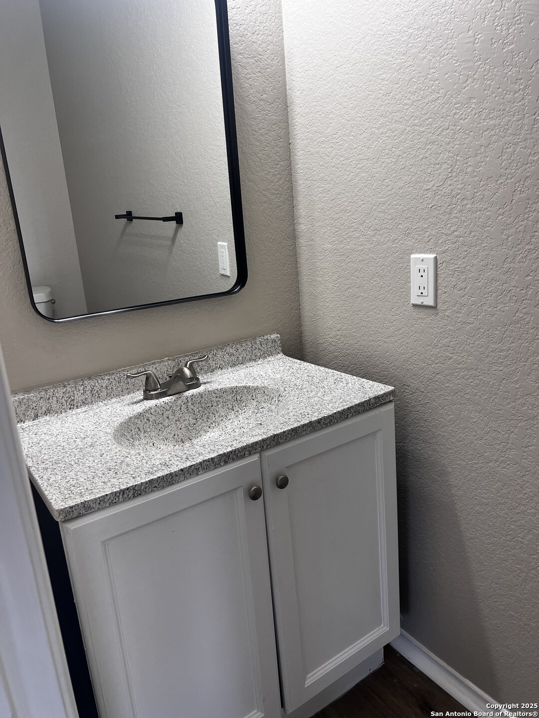 735 Inks Farm San Antonio, TX 78228 - Photo 9 of 17 a bathroom with a granite countertop sink and a mirror