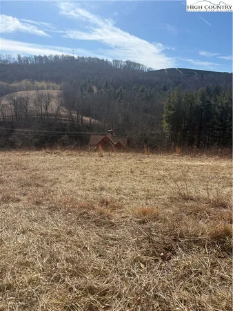 a view of a lake view with mountains in the background