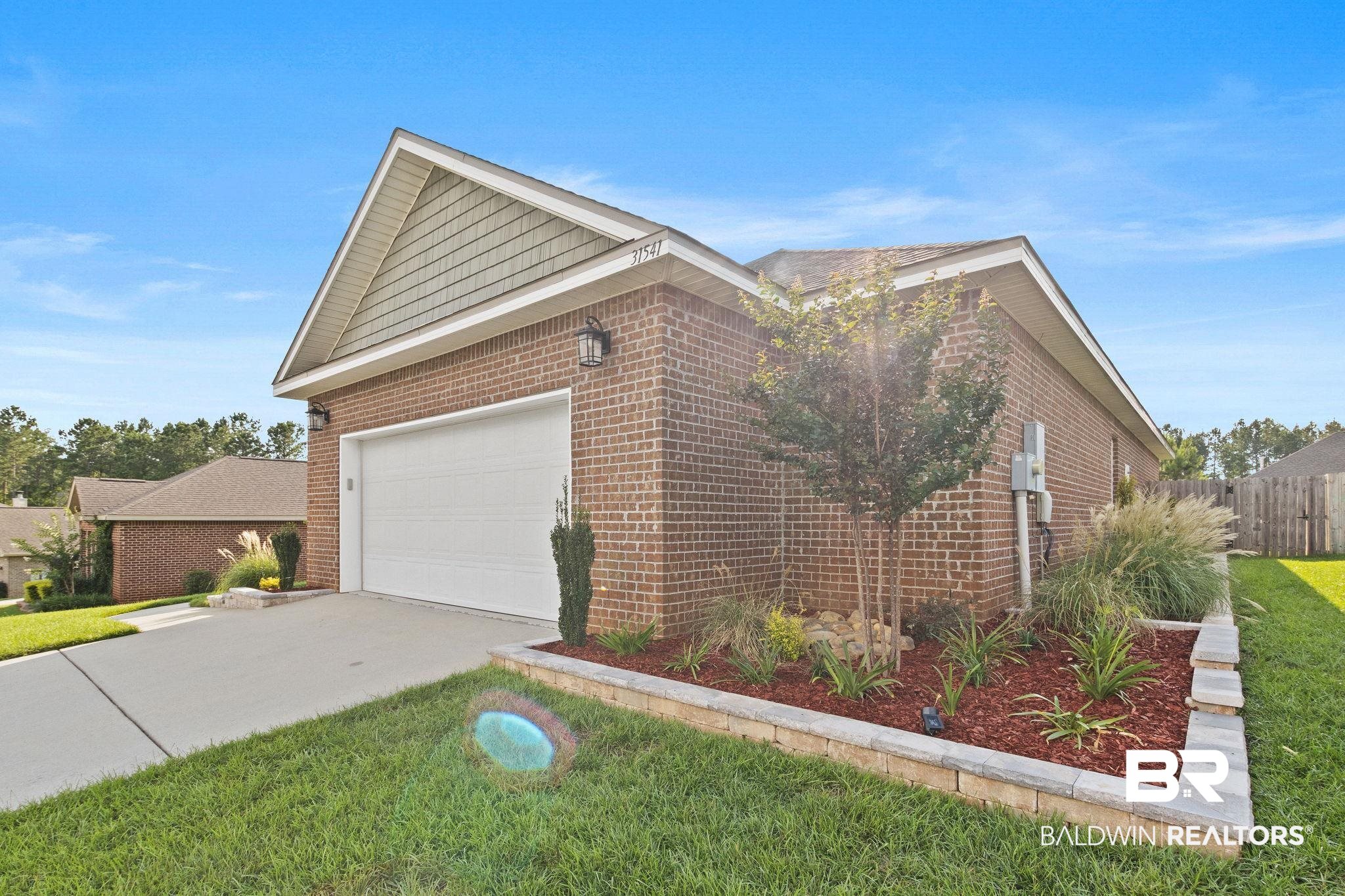 31541 Hoot Owl Road Daphne, AL 36527 - Photo 45 of 51 Exterior space featuring a garage and a front yard