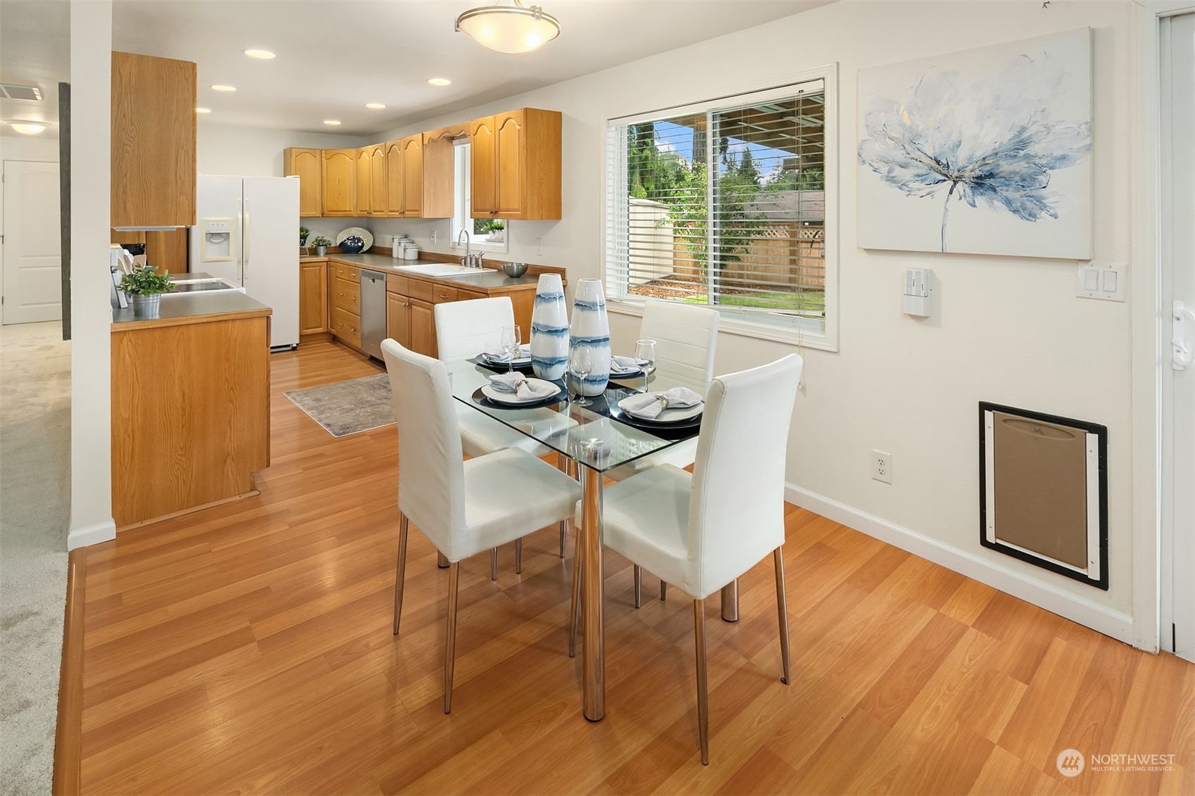 2919 Stafford Way Bothell, WA 98012 - Photo 13 of 30 a view of a dining room with furniture window and wooden floor