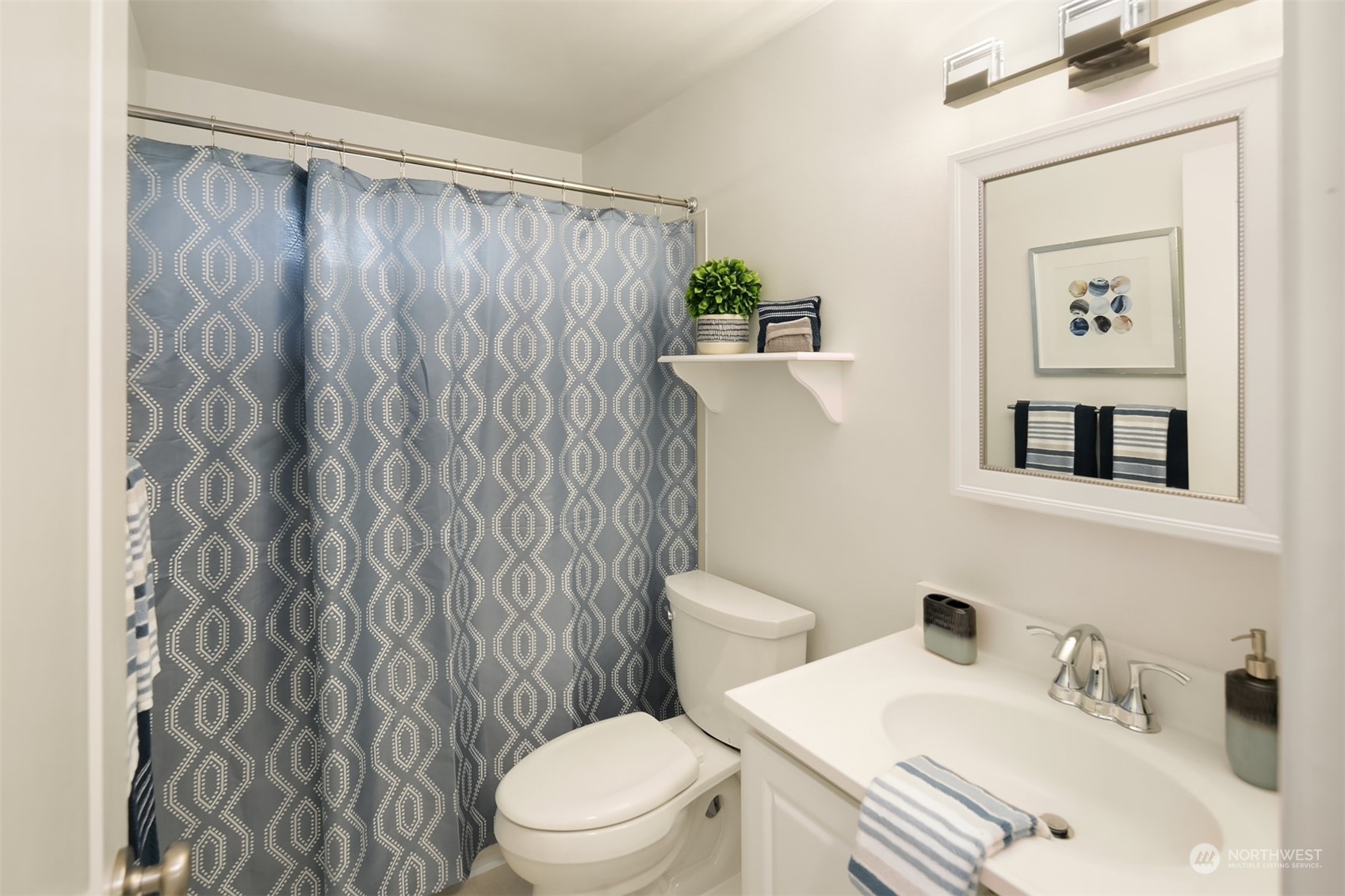 2919 Stafford Way Bothell, WA 98012 - Photo 22 of 30 a white toilet sitting next to a bathroom sink