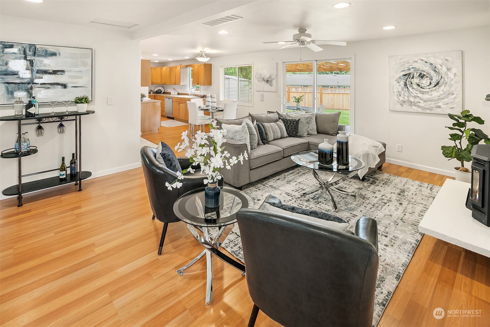 2919 Stafford Way Bothell, WA 98012 - Photo 9 of 30 a living room with furniture wooden floor and kitchen view