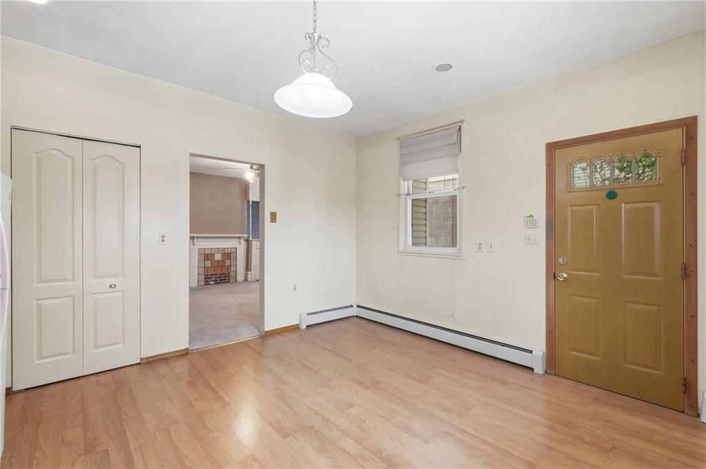 373 Copperfield Avenue Pittsburgh, PA 15210 - Photo 15 of 39 a view of empty room with wooden floor