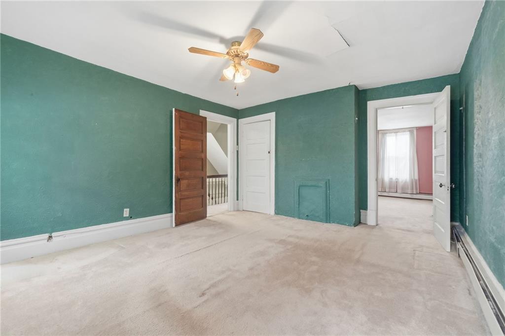 373 Copperfield Avenue Pittsburgh, PA 15210 - Photo 19 of 39 a view of an empty room with a chandelier fan