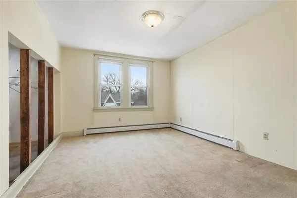 an empty room with a empty space and a window