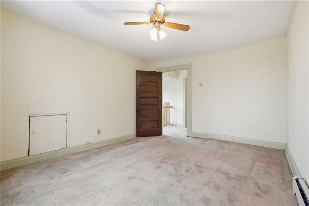 373 Copperfield Avenue Pittsburgh, PA 15210 - Photo 28 of 39 an empty room with closet and a chandelier fan