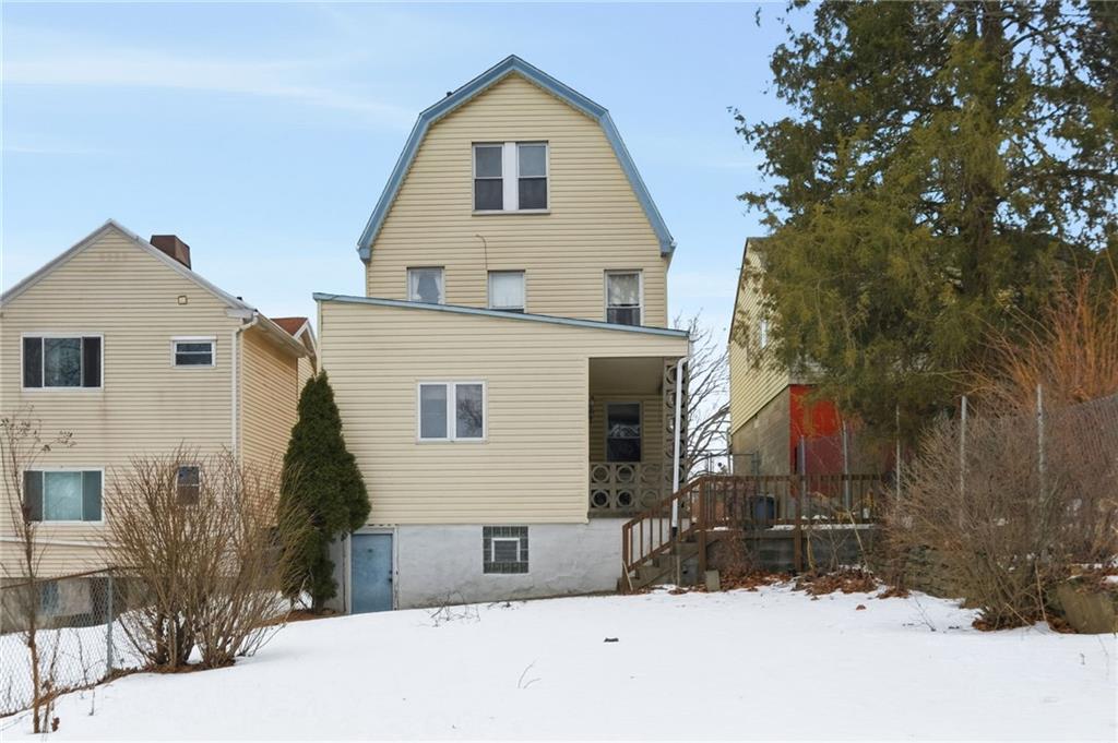 373 Copperfield Avenue Pittsburgh, PA 15210 - Photo 34 of 39 a view of house with a yard in the background