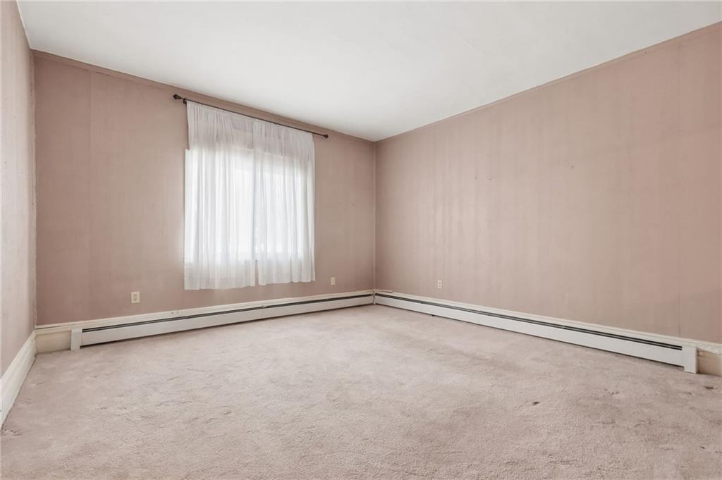 373 Copperfield Avenue Pittsburgh, PA 15210 - Photo 7 of 39 a view of an empty room with a window