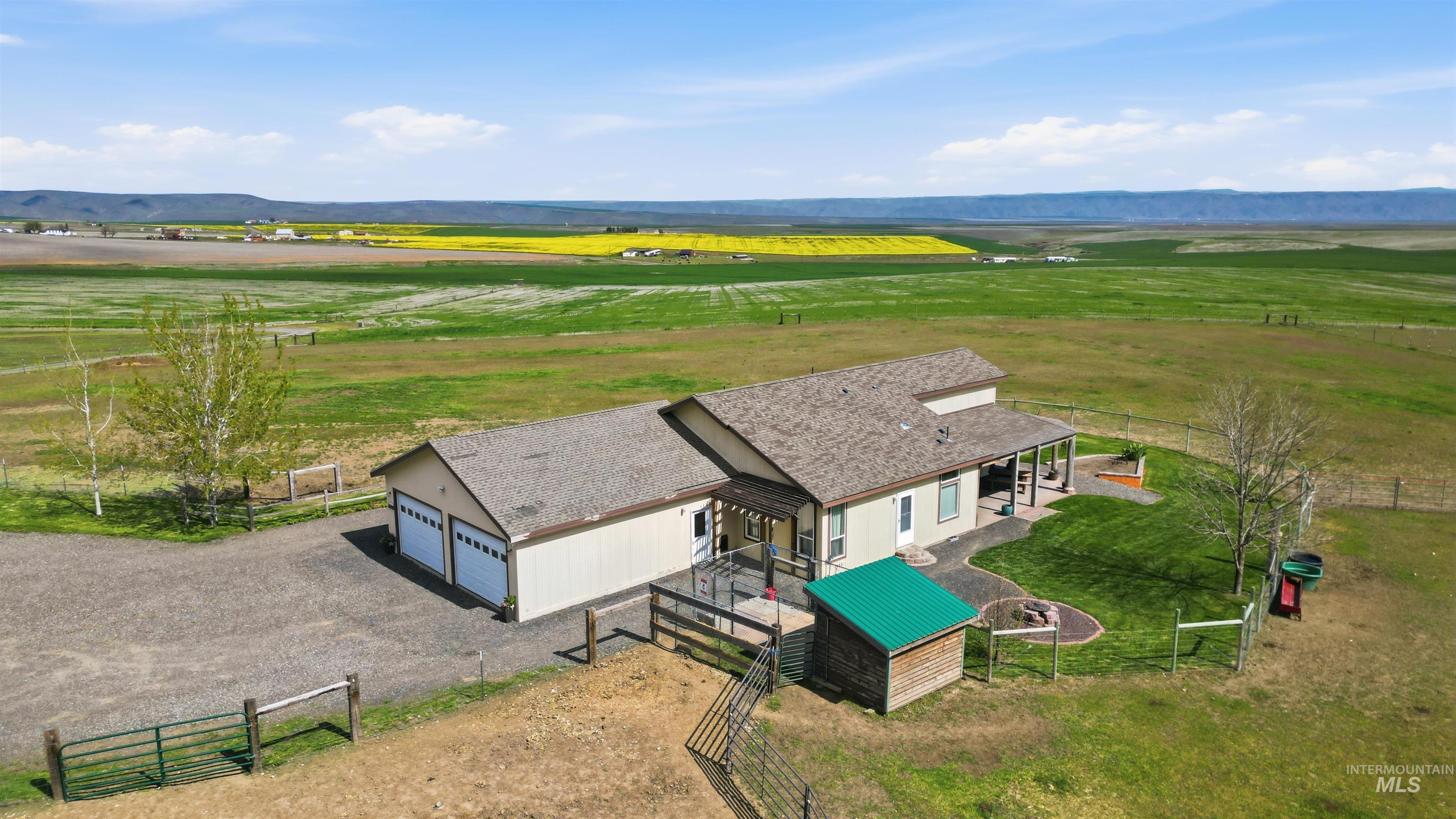 19397 Cloverland Road Asotin, WA 99402 - Photo 27 of 37 Single-story residence with an attached two-car garage, covered front porch, and a fenced backyard area