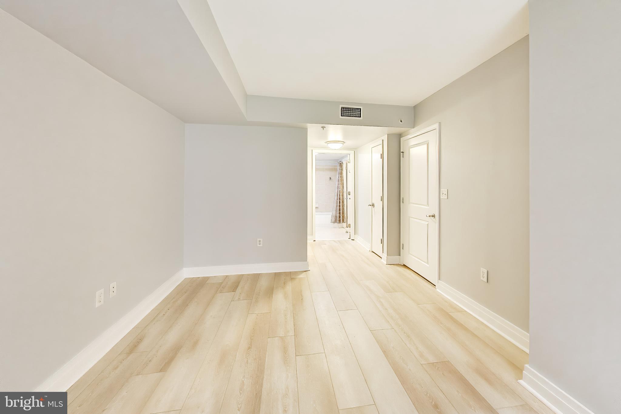 915 E Street Northwest, Unit 414 Washington, DC 20004 - Photo 15 of 35 a view of empty room with wooden floor
