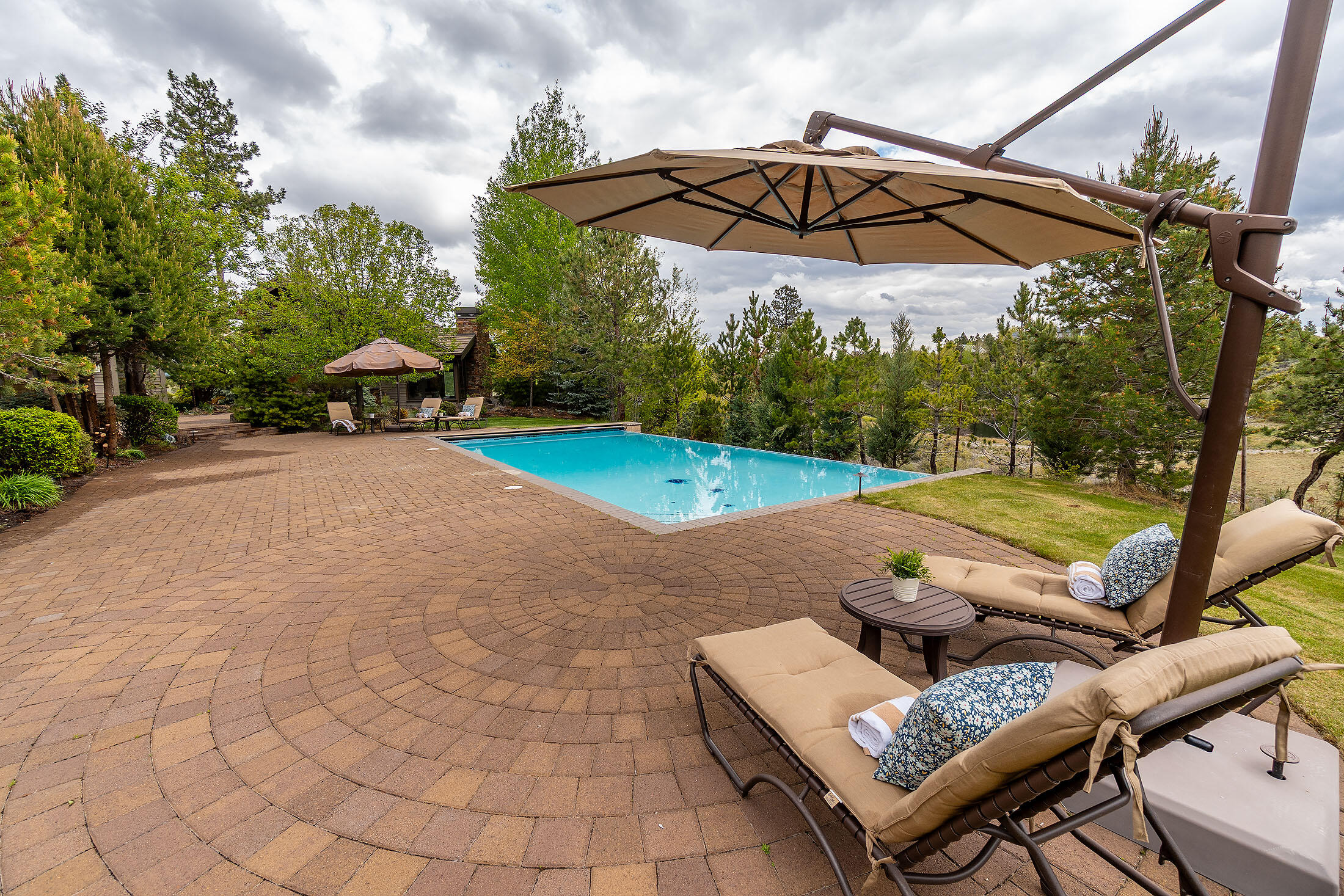 18883 Sutherland Court Bend, OR 97702 - Photo 52 of 70 Crystal-clear waters and elegant stonework invite relaxation in this private oasis.
