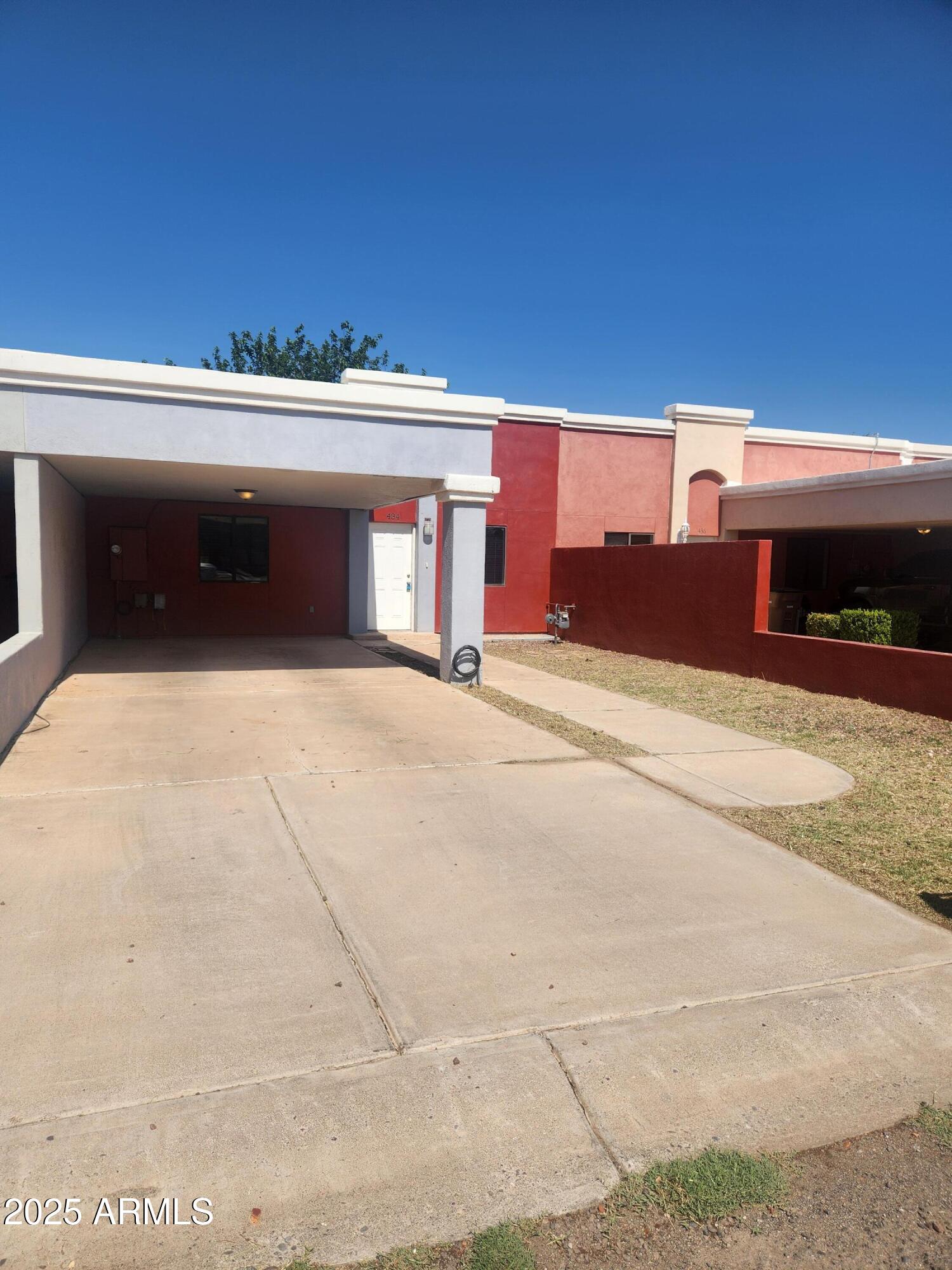 a view of the front of house with a yard and garage