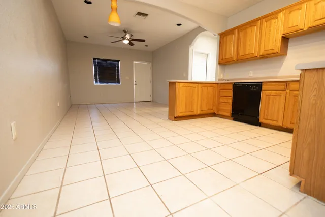 a bathroom with a toilet and a mirror