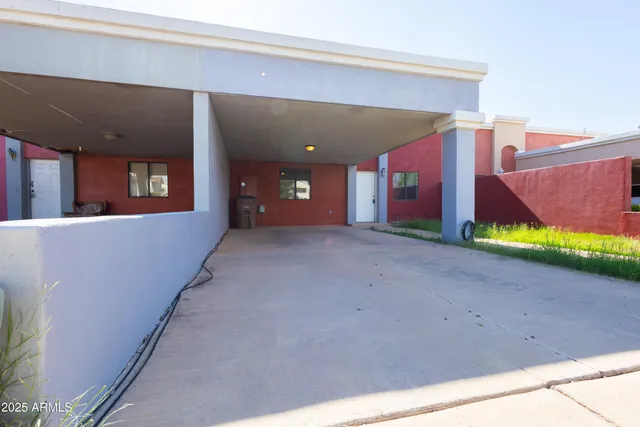 a view of a house with a yard and garage