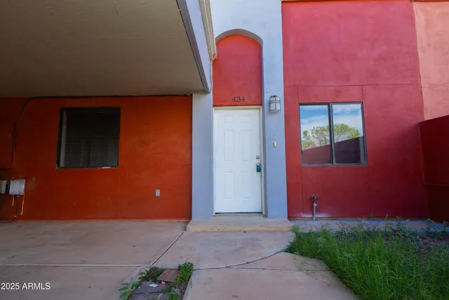 a view of a yard with a large tree