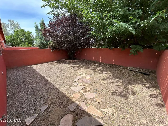 a view of backyard with green space