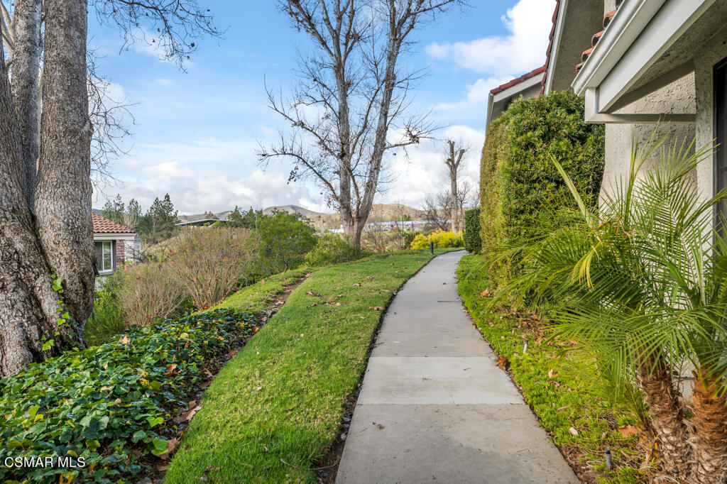 1003 Thistlegate Road Oak Park, CA 91377 - Photo 3 of 36 a view of a garden with a pathway