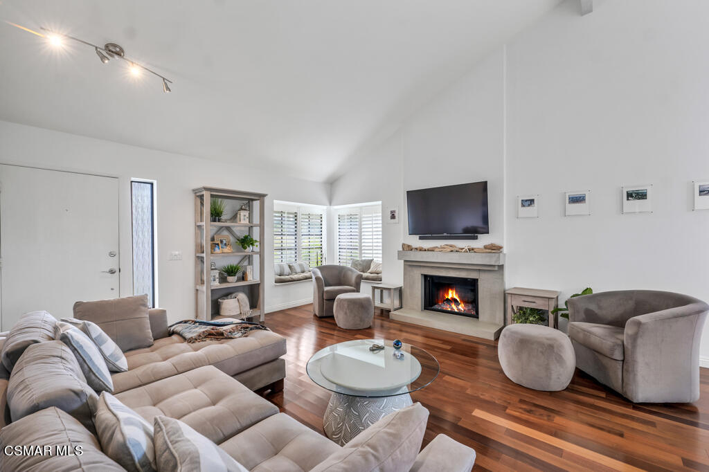 1003 Thistlegate Road Oak Park, CA 91377 - Photo 5 of 36 a living room with furniture and a fireplace