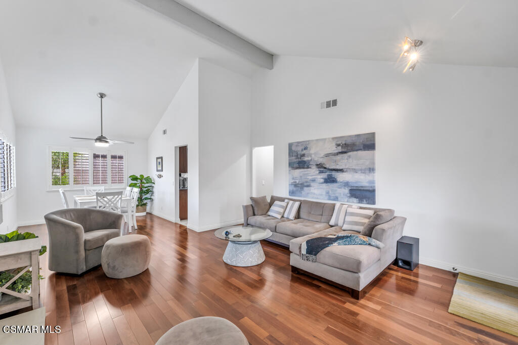 1003 Thistlegate Road Oak Park, CA 91377 - Photo 8 of 36 a living room with furniture and wooden floor