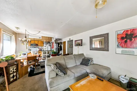 a living room with furniture and a couch