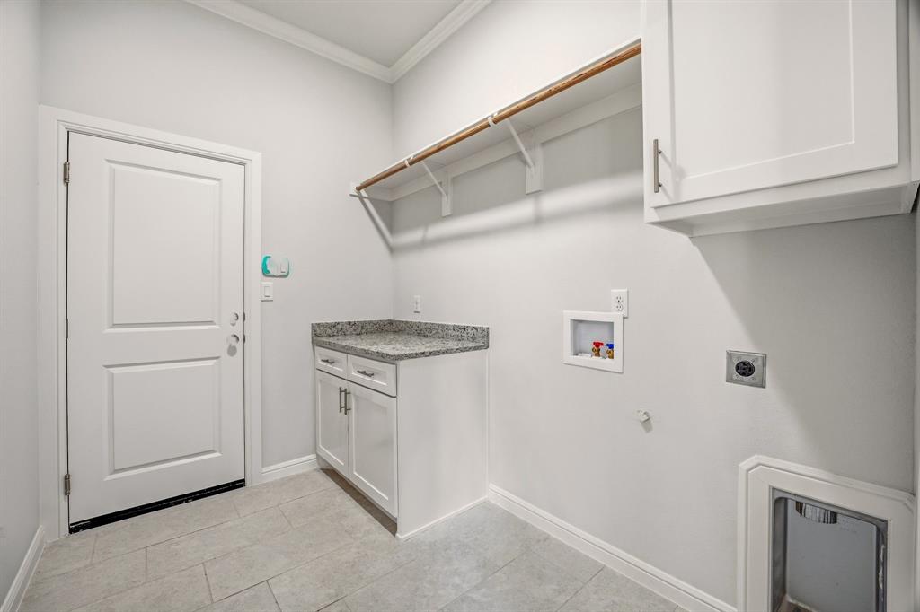 2017 Forest Bridge Azle, TX 76020 - Photo 22 of 30 Laundry room featuring crown molding, cabinet space, hookup for a gas dryer, washer hookup, and electric dryer hookup