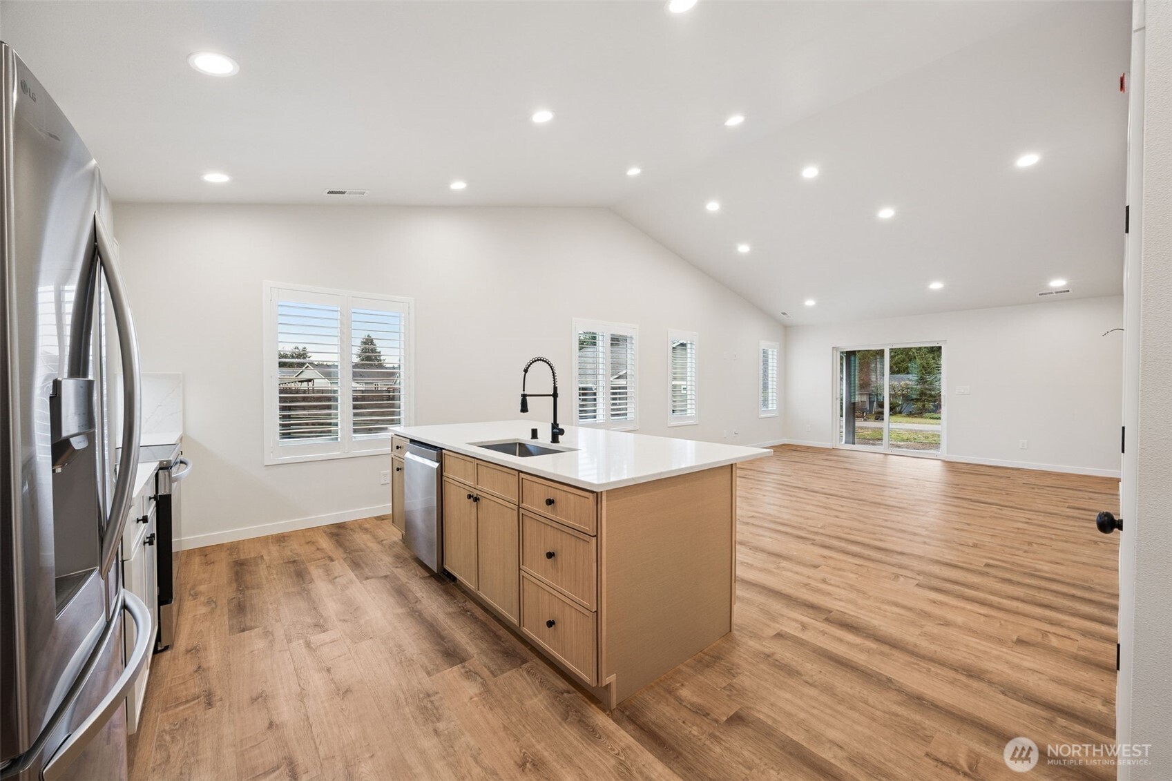 401 Pershing Avenue Carbonado, WA 98323 - Photo 11 of 38 a kitchen with stainless steel appliances granite countertop a stove and a sink