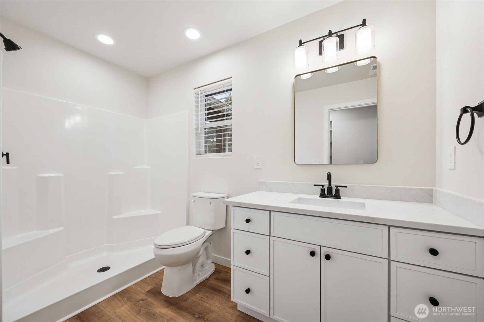 401 Pershing Avenue Carbonado, WA 98323 - Photo 15 of 38 a bathroom with a toilet a sink a mirror a bathtub and vanity