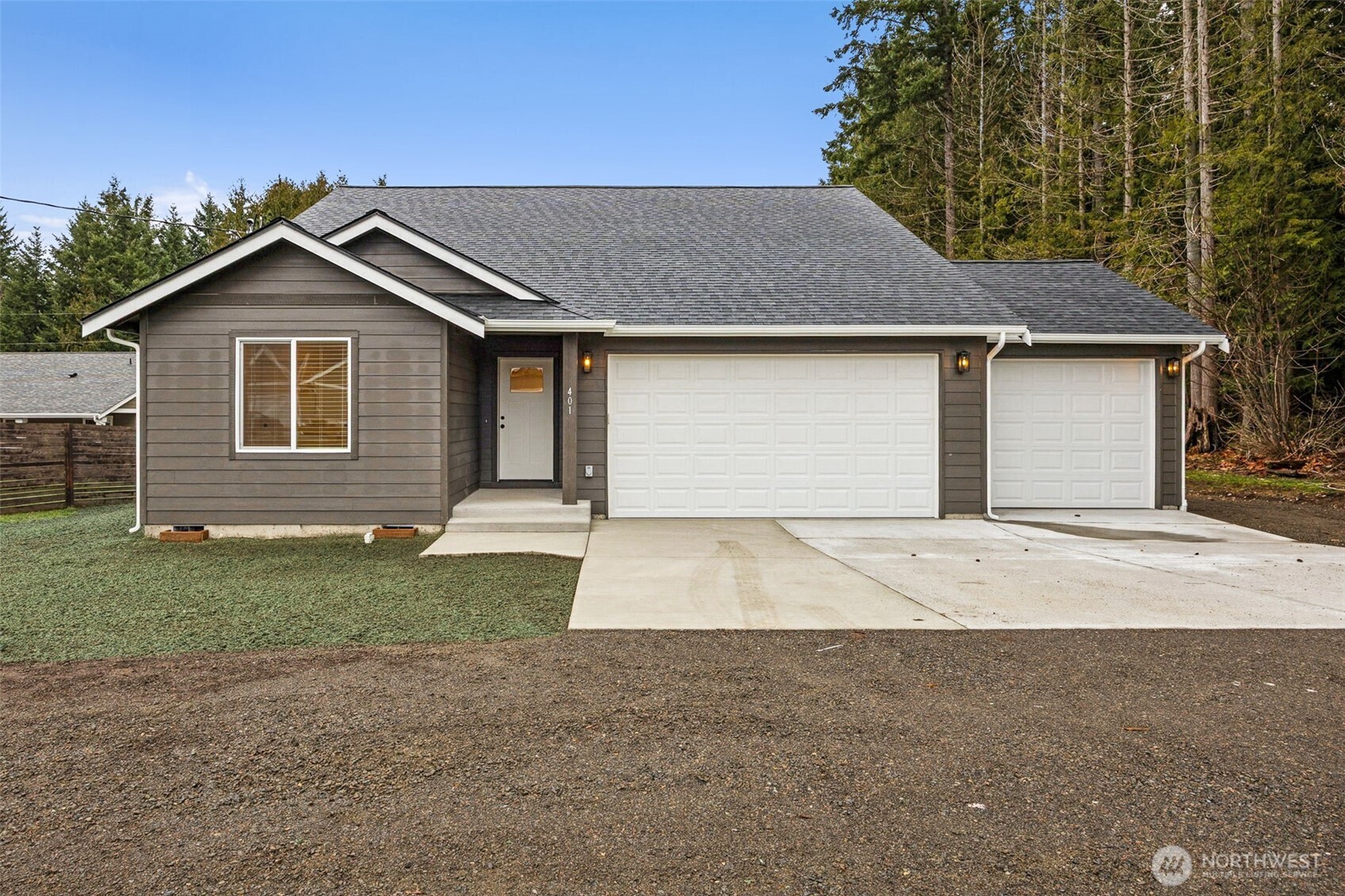 401 Pershing Avenue Carbonado, WA 98323 - Photo 2 of 38 a front view of a house with a yard and garage