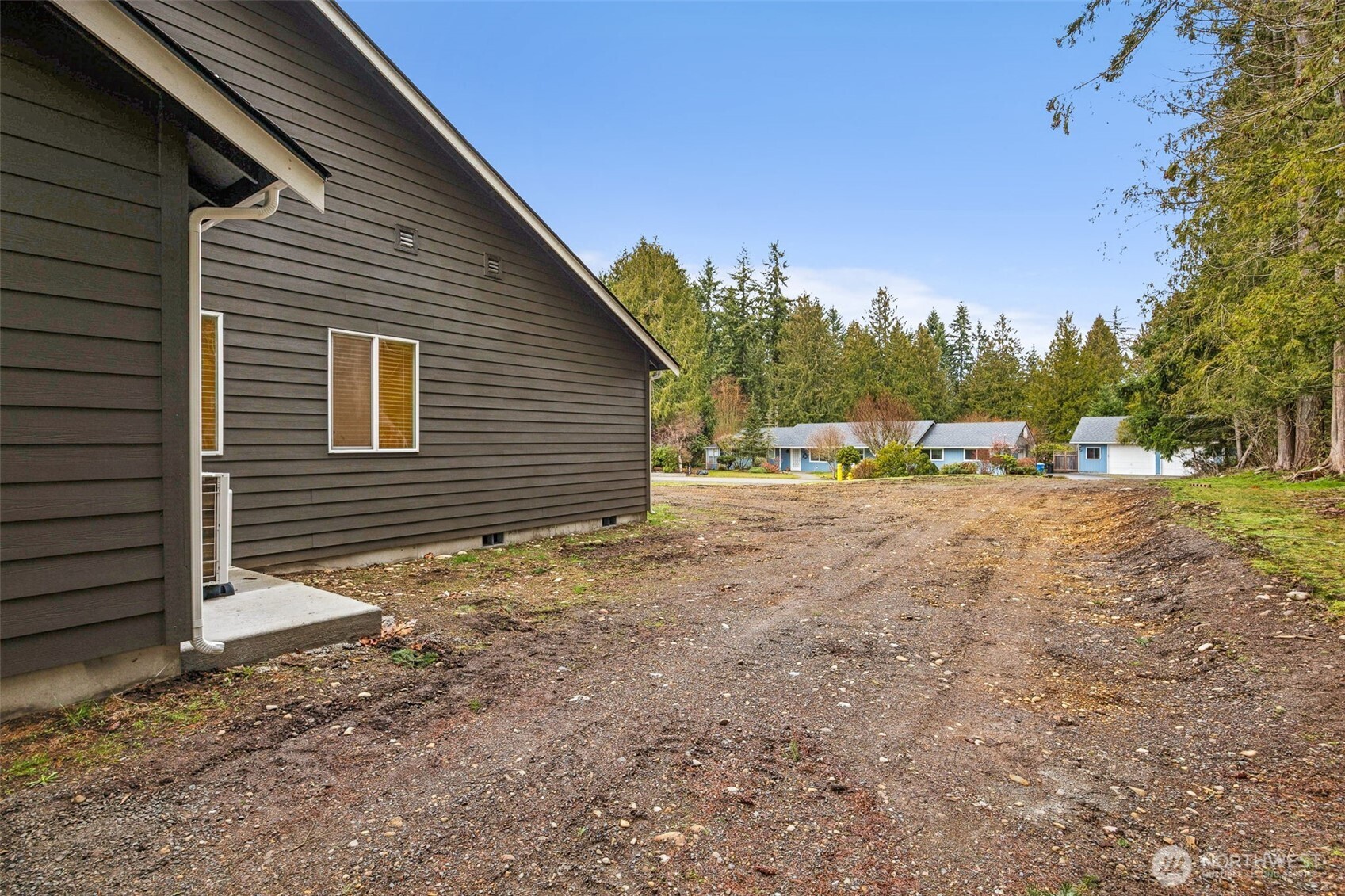 401 Pershing Avenue Carbonado, WA 98323 - Photo 26 of 38 a view of a house with backyard and trees