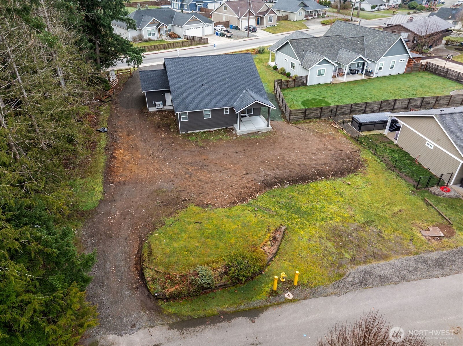 401 Pershing Avenue Carbonado, WA 98323 - Photo 34 of 38 an aerial view of a house with a yard and lake view