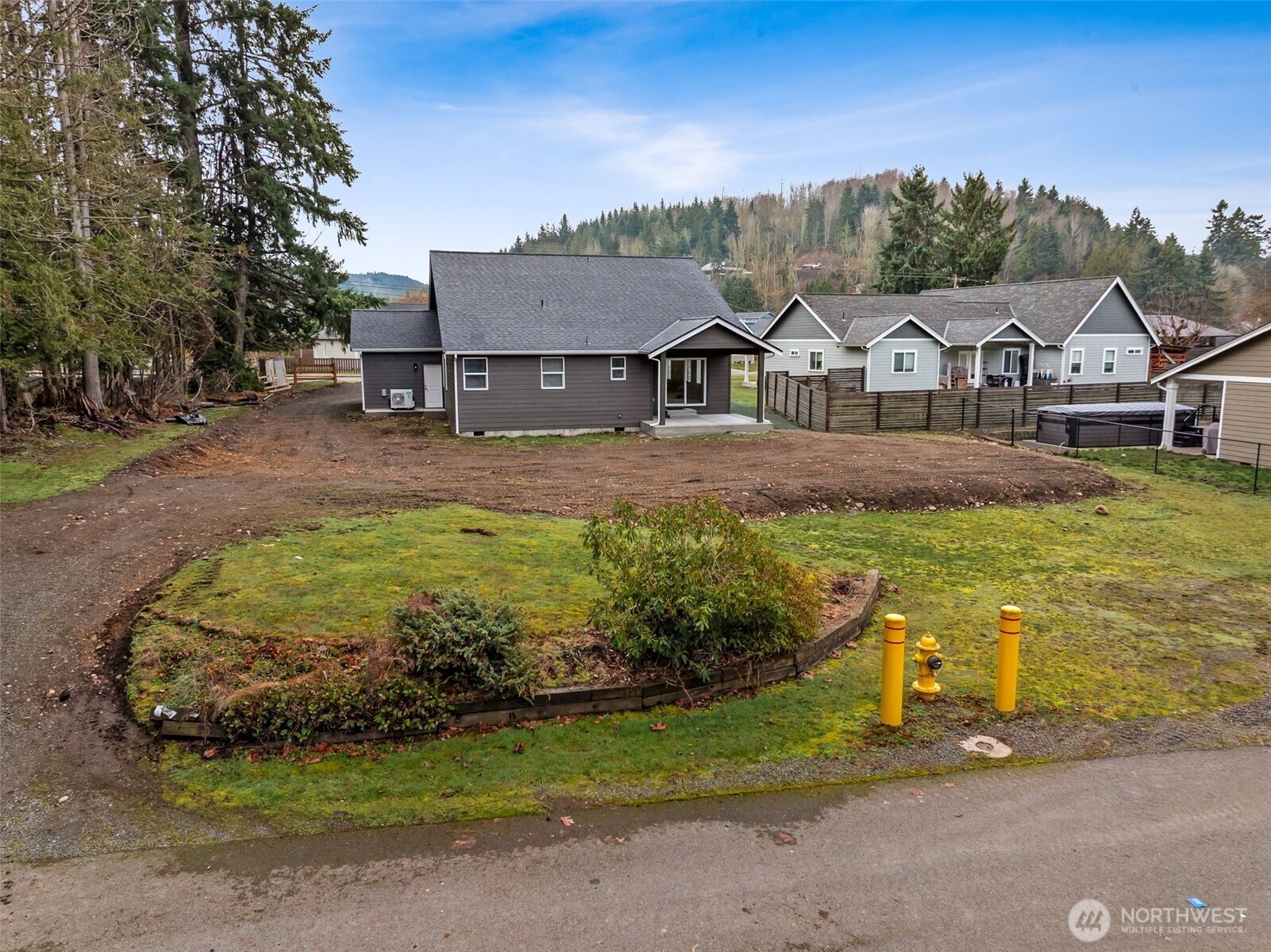 401 Pershing Avenue Carbonado, WA 98323 - Photo 4 of 38 a view of a big house with a big yard and large trees