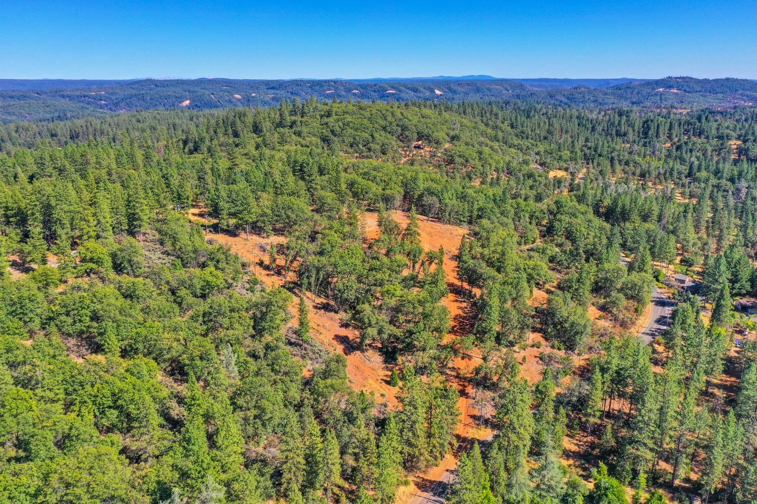 15722 Lower Colfax Road Grass Valley, CA 95945 - Photo 11 of 24 a view of a city with lush green forest