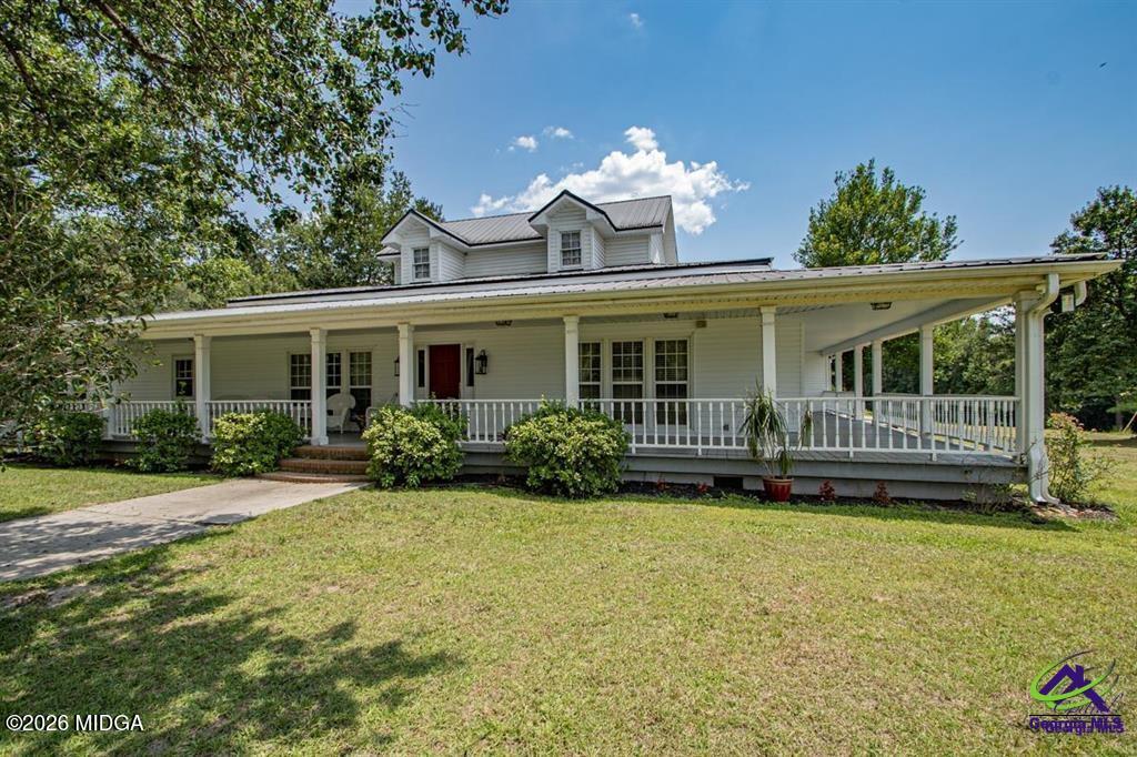1441 Zenith Mill Road Roberta, GA 31078 - Photo 1 of 80 a view of a house with a yard and potted plants