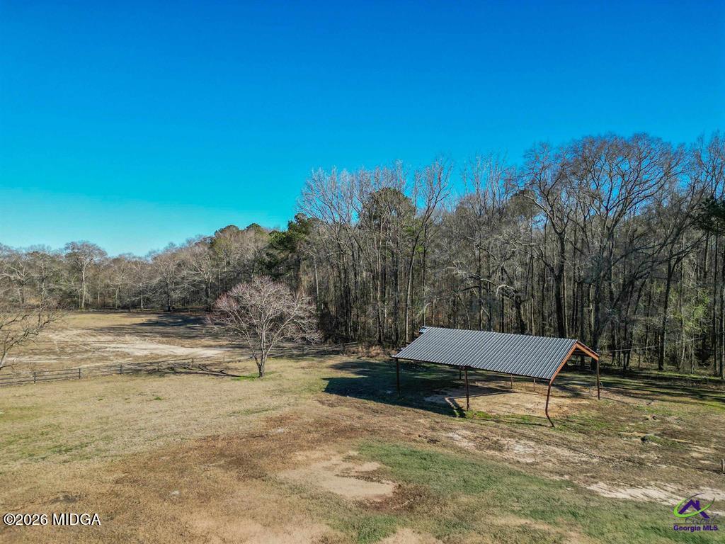 1441 Zenith Mill Road Roberta, GA 31078 - Photo 13 of 80 a wooden bench sitting in the middle of a yard