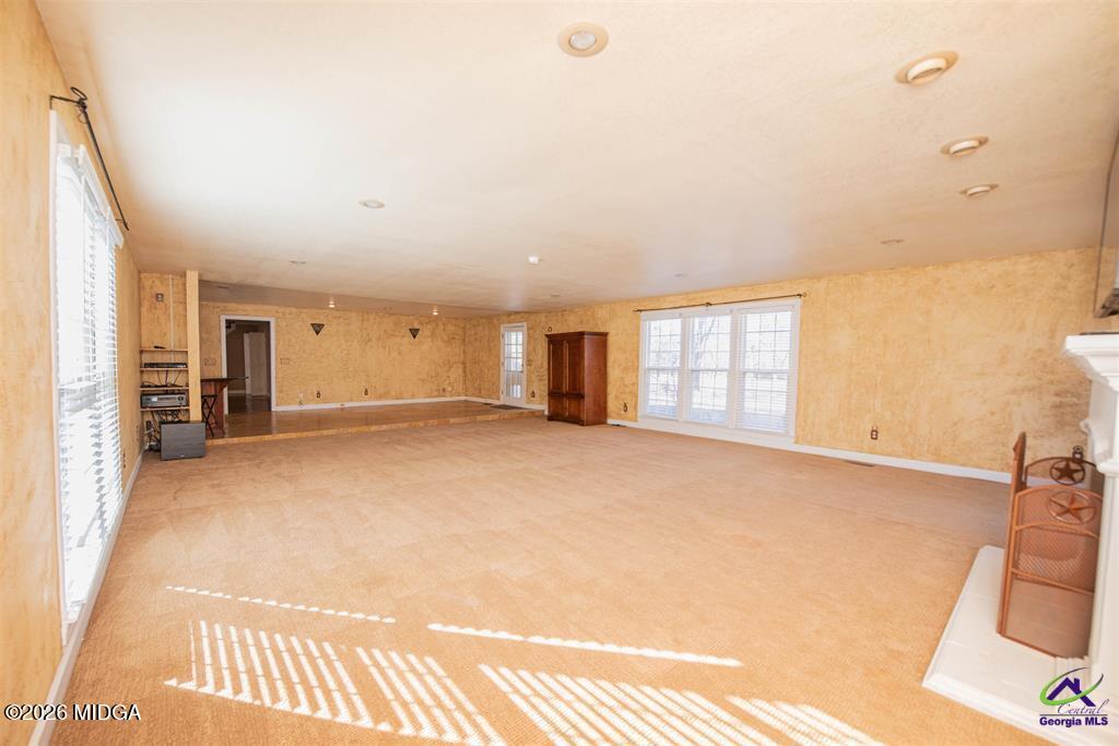 1441 Zenith Mill Road Roberta, GA 31078 - Photo 30 of 80 a view of an empty room with a fireplace