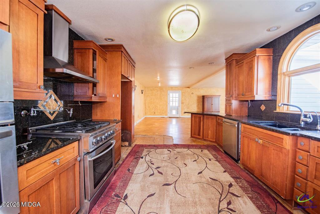 1441 Zenith Mill Road Roberta, GA 31078 - Photo 35 of 80 a kitchen with stainless steel appliances granite countertop a stove a sink and a microwave