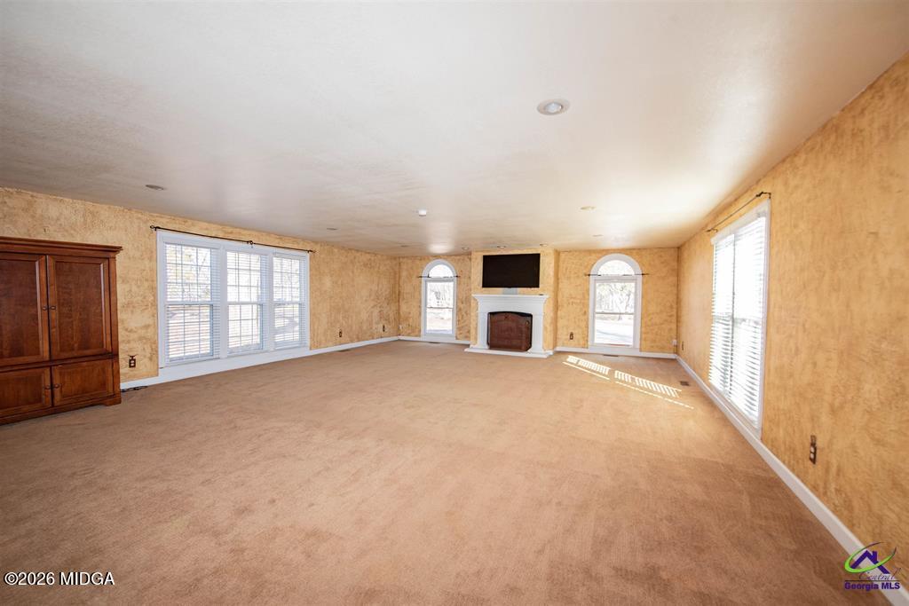 1441 Zenith Mill Road Roberta, GA 31078 - Photo 39 of 80 a view of empty room with a fireplace and windows