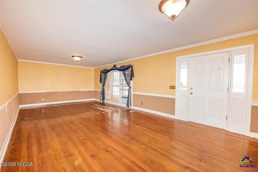 1441 Zenith Mill Road Roberta, GA 31078 - Photo 49 of 80 a view of an empty room with wooden floor and a window