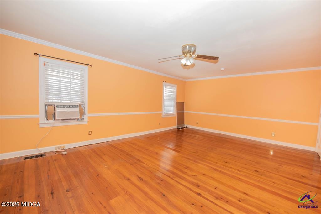 1441 Zenith Mill Road Roberta, GA 31078 - Photo 52 of 80 an empty room with wooden floor and windows