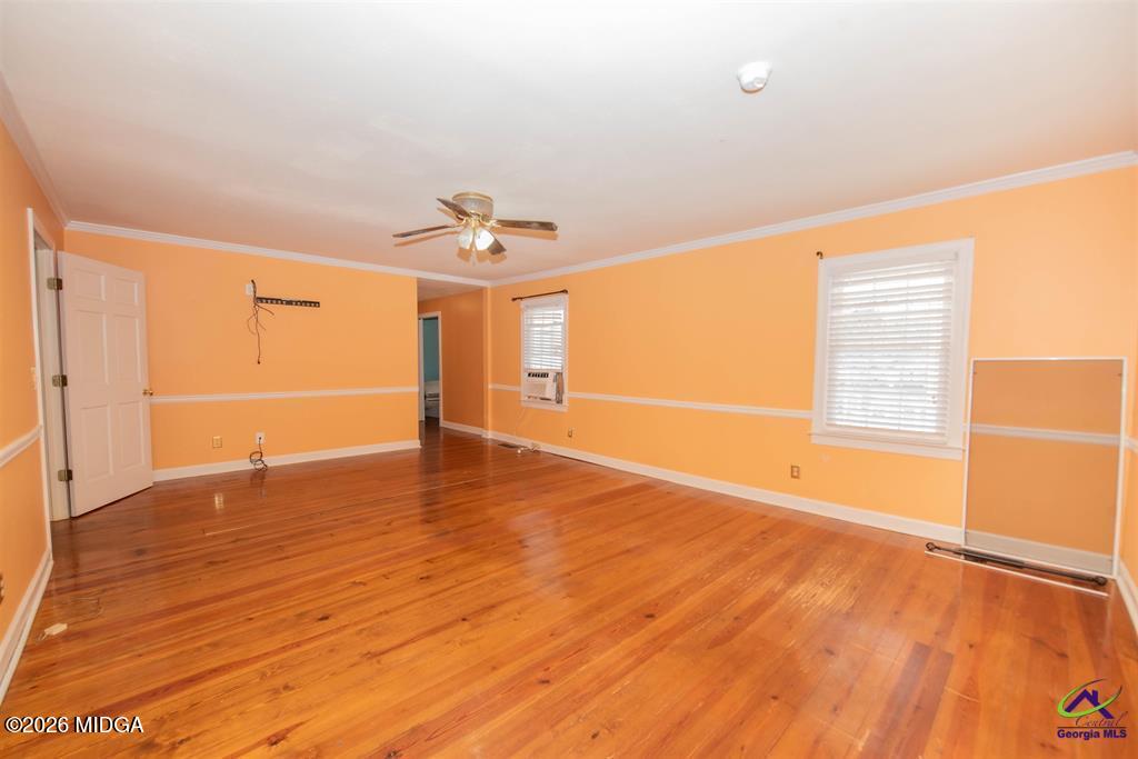 1441 Zenith Mill Road Roberta, GA 31078 - Photo 53 of 80 a view of an empty room with wooden floor and a window