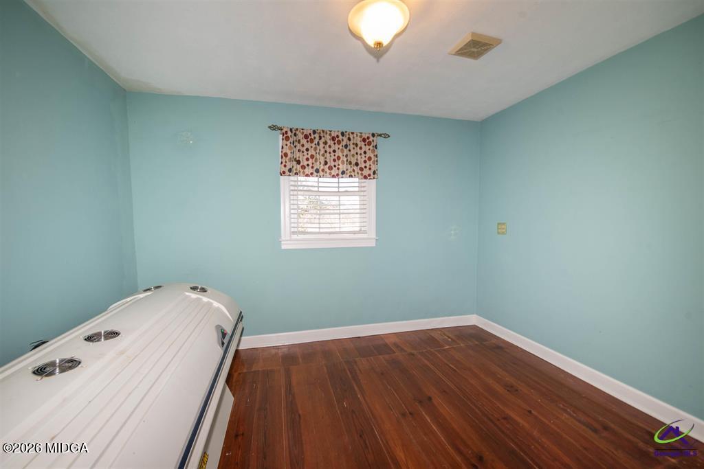 1441 Zenith Mill Road Roberta, GA 31078 - Photo 58 of 80 a view of a hallway with wooden floor and a window