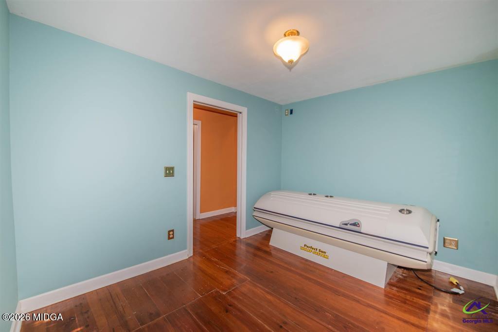 1441 Zenith Mill Road Roberta, GA 31078 - Photo 59 of 80 a bathroom with a sink a toilet and a shower