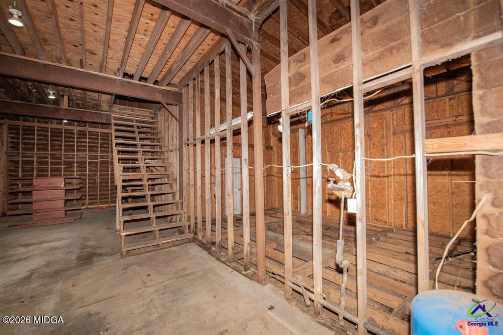 1441 Zenith Mill Road Roberta, GA 31078 - Photo 76 of 80 a view of an empty room with wooden stairs